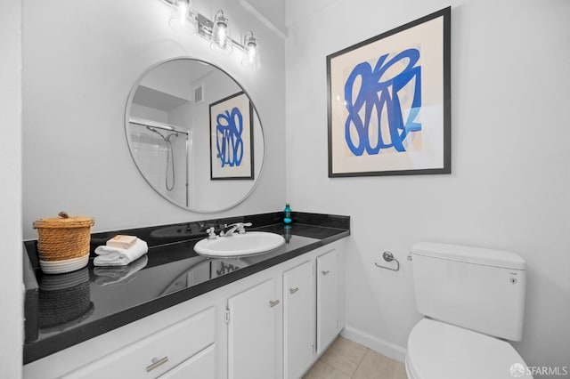 bathroom with a shower, tile patterned floors, toilet, and vanity