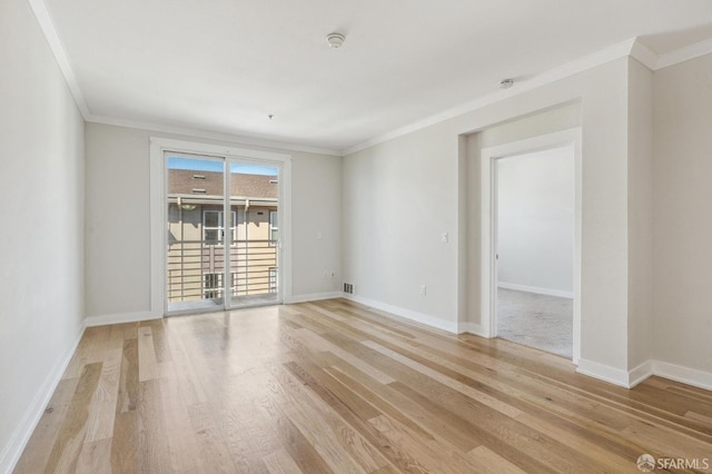 unfurnished room with ornamental molding and light hardwood / wood-style flooring