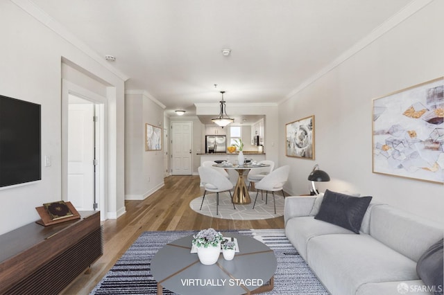 living room featuring crown molding and hardwood / wood-style floors