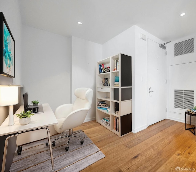 office with light hardwood / wood-style floors