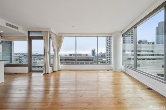 unfurnished sunroom featuring a healthy amount of sunlight