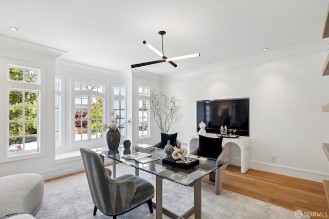 dining room featuring light wood-style floors, baseboards, crown molding, and recessed lighting