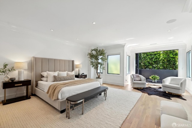 bedroom featuring ornamental molding, light wood finished floors, recessed lighting, access to outside, and baseboards