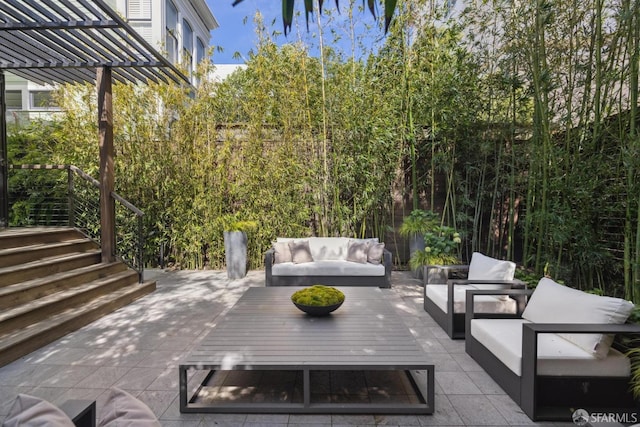 view of patio featuring an outdoor living space and a pergola