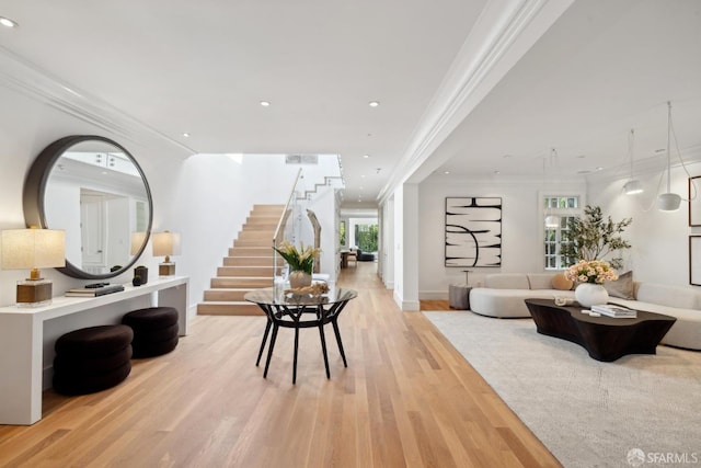 living room featuring light wood-style floors, stairway, recessed lighting, crown molding, and baseboards