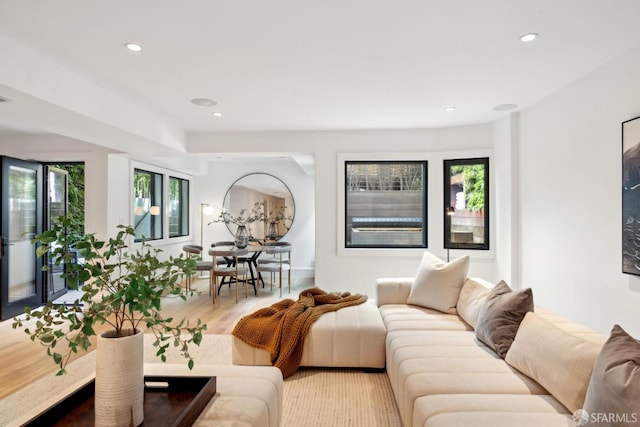 living room with recessed lighting and wood finished floors