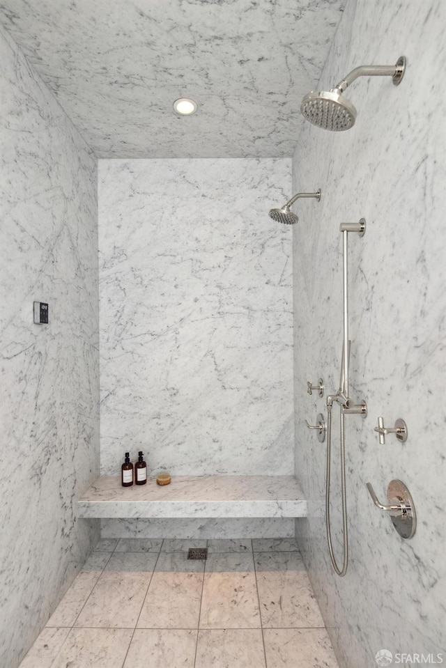 bathroom with a marble finish shower