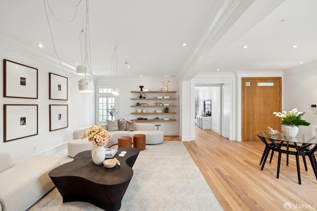 living area featuring light wood finished floors, crown molding, recessed lighting, and baseboards