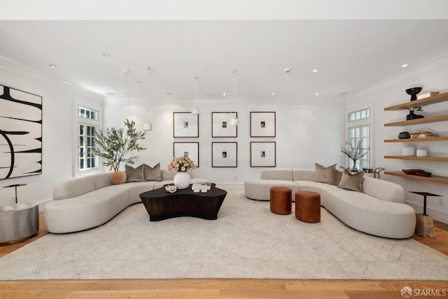 living room with ornamental molding, recessed lighting, and wood finished floors