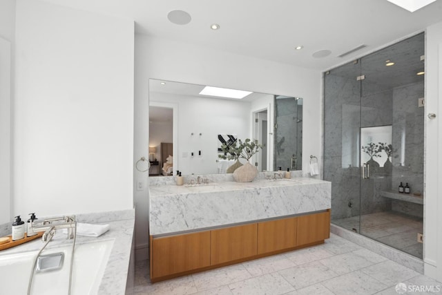 bathroom with ensuite bath, a skylight, a marble finish shower, double vanity, and recessed lighting