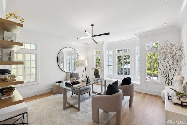 office space with plenty of natural light, crown molding, wood finished floors, baseboards, and recessed lighting