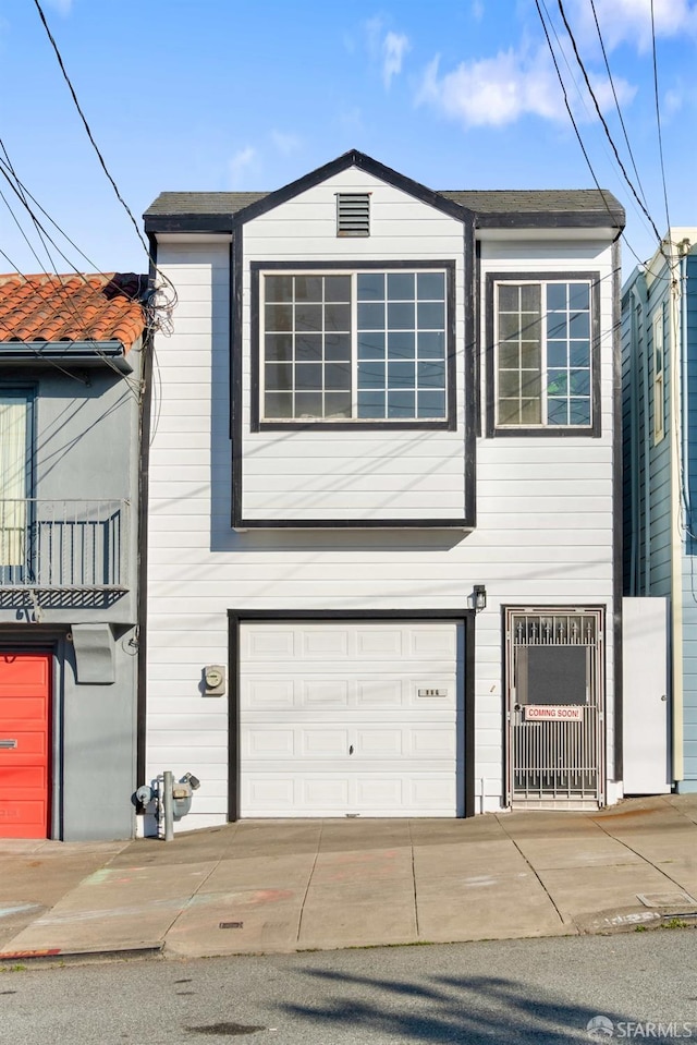 view of front facade with a garage and driveway