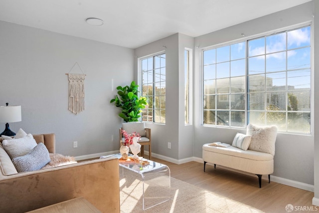 interior space with light wood-style flooring and baseboards