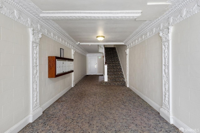 corridor featuring carpet floors and stairs