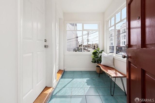 unfurnished sunroom with plenty of natural light