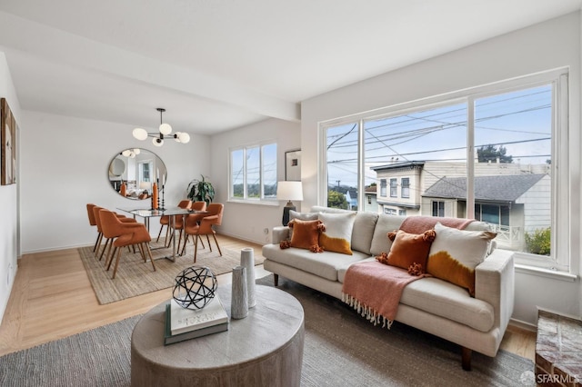 75 Lurline St, San Francisco, CA 94122 - living room with a chandelier, baseboards, and wood finished floors