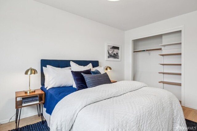 75 Lurline St, San Francisco, CA 94122 - bedroom featuring wood finished floors, baseboards, and a closet