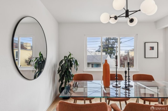 75 Lurline St, San Francisco, CA 94122 - dining space featuring a chandelier, wood finished floors, and baseboards