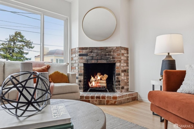 75 Lurline St, San Francisco, CA 94122 - living room with wood finished floors, a brick fireplace, and baseboards