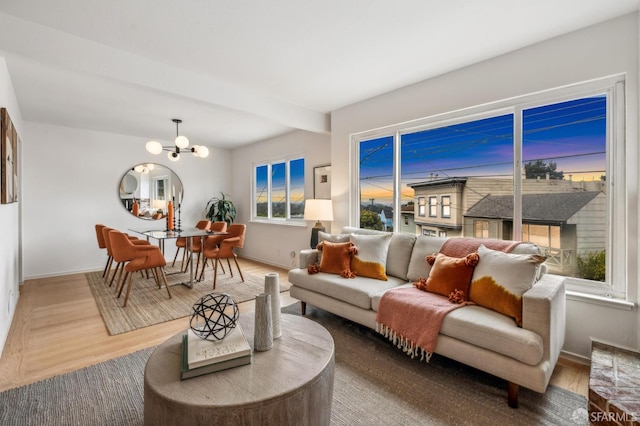 75 Lurline St, San Francisco, CA 94122 - living area featuring a chandelier, baseboards, wood finished floors, and beamed ceiling