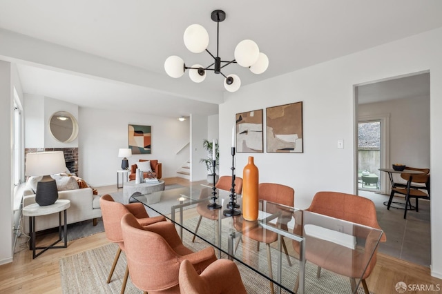 75 Lurline St, San Francisco, CA 94122 - dining area featuring stairway, light wood-style floors, and a chandelier