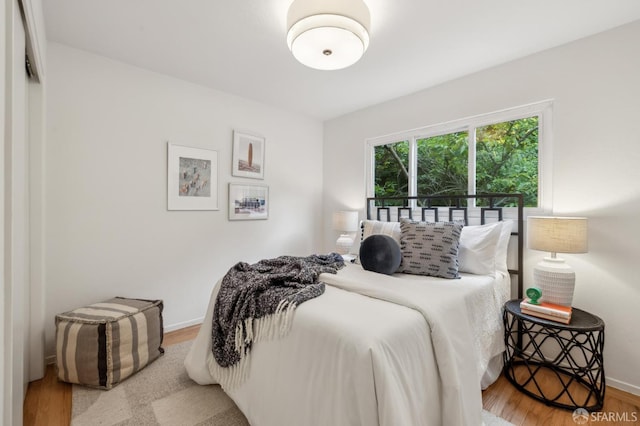 75 Lurline St, San Francisco, CA 94122 - bedroom with wood finished floors and baseboards
