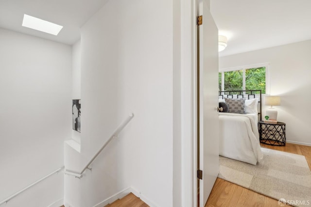 75 Lurline St, San Francisco, CA 94122 - stairs with a skylight and wood finished floors
