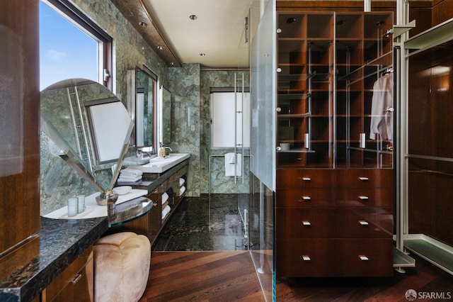 bathroom featuring vanity and a stall shower