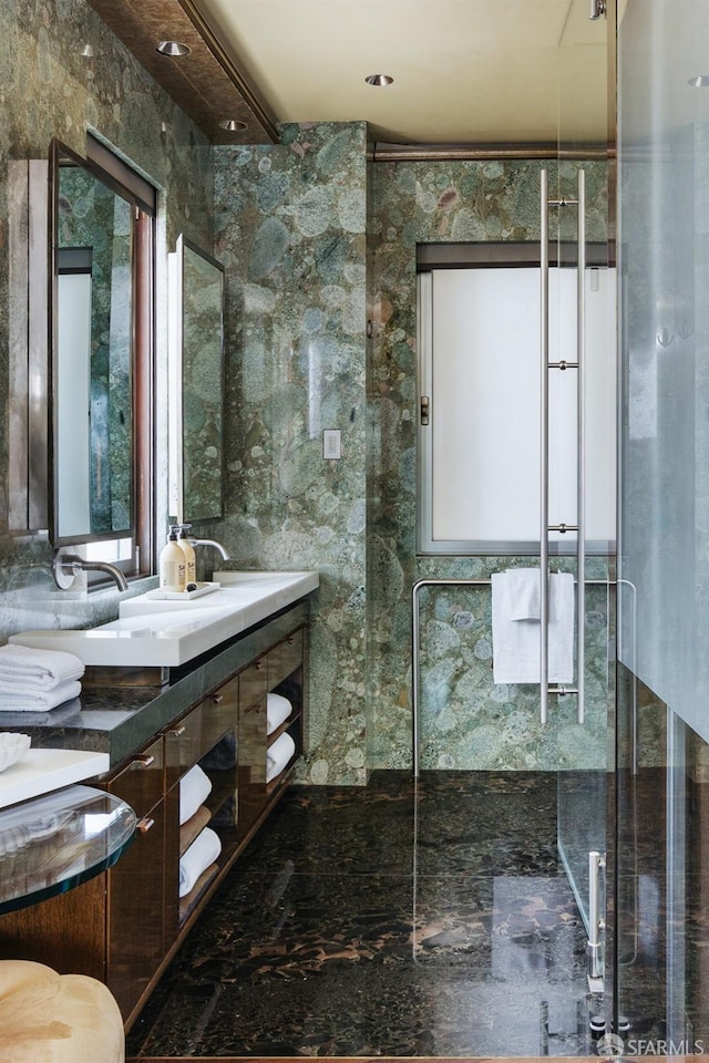 full bathroom with vanity and a shower stall