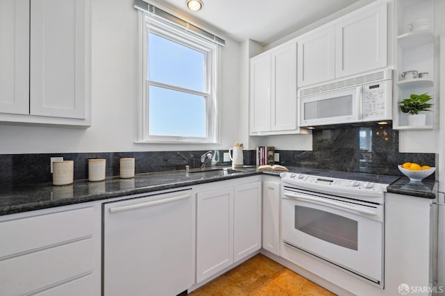 kitchen with white appliances, a sink, white cabinetry, open shelves, and tasteful backsplash