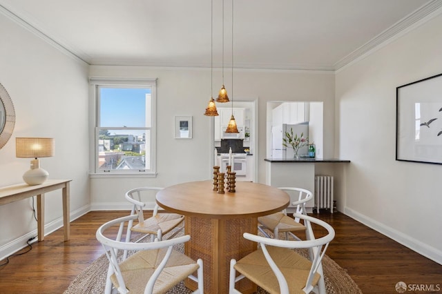 dining space with radiator, crown molding, baseboards, and dark wood-style flooring