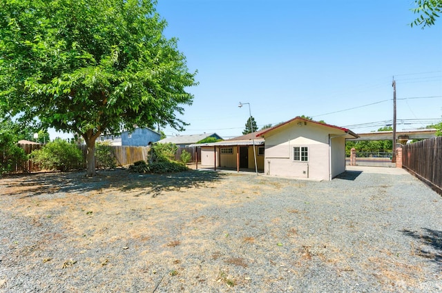 1220 Mesa St, Concord, CA 94518 - rear view of house with a fenced backyard and stucco siding