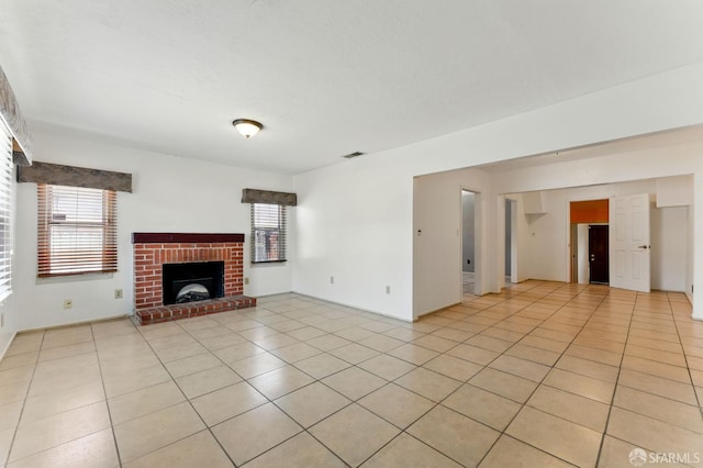 1220 Mesa St, Concord, CA 94518 - unfurnished living room with plenty of natural light, a brick fireplace, and light tile patterned floors