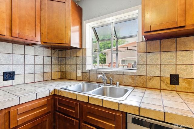 1220 Mesa St, Concord, CA 94518 - kitchen with dishwashing machine, tile counters, decorative backsplash, and brown cabinets