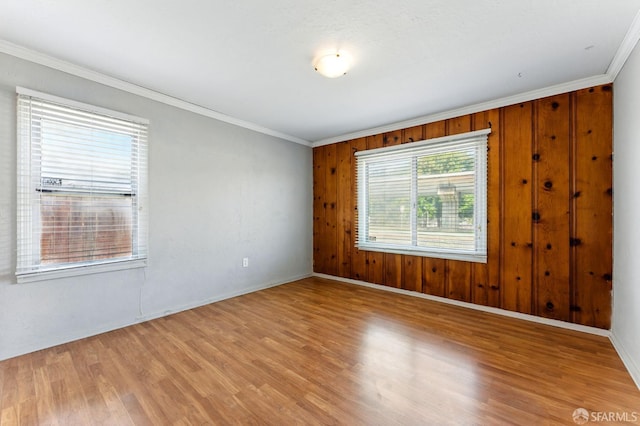 1220 Mesa St, Concord, CA 94518 - empty room featuring crown molding, light wood-style floors, and wooden walls