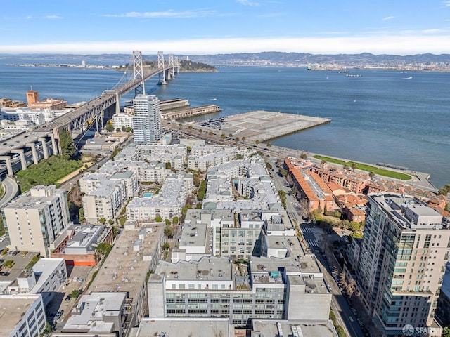 drone / aerial view featuring a view of city and a water view