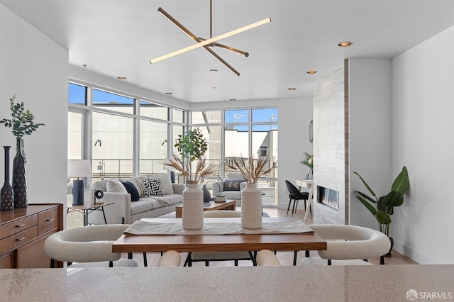 living room with a fireplace and recessed lighting