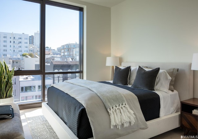 bedroom with a view of city