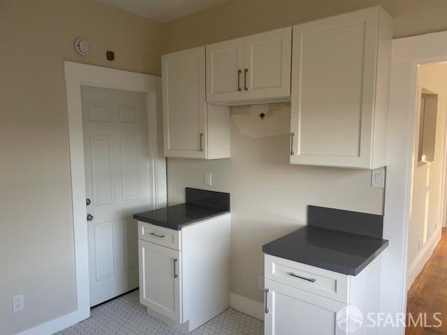 kitchen featuring white cabinets