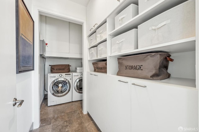 laundry room with cabinets and washing machine and dryer