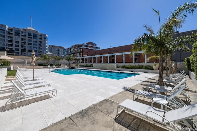 view of swimming pool featuring a patio