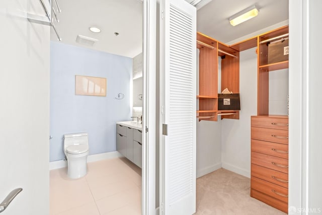 bathroom featuring vanity, toilet, and tile patterned flooring