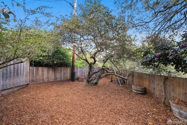 view of yard featuring a fenced backyard