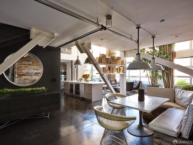 dining room with a healthy amount of sunlight and finished concrete flooring