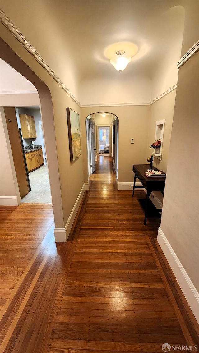 corridor featuring dark wood-type flooring