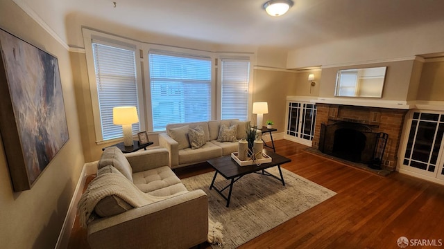 living room featuring a fireplace and dark wood-type flooring