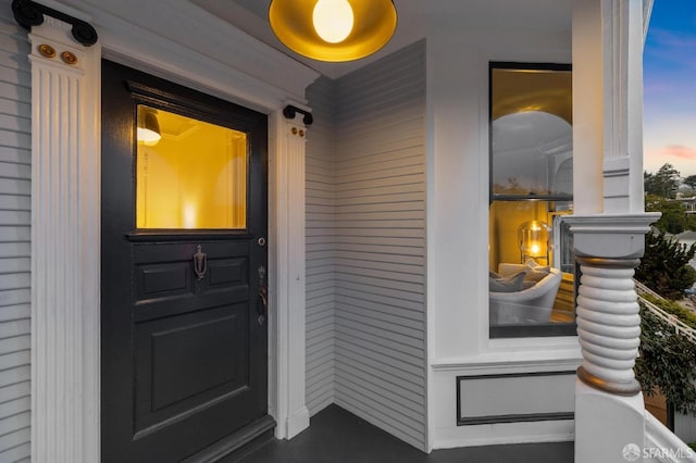 doorway to property featuring covered porch