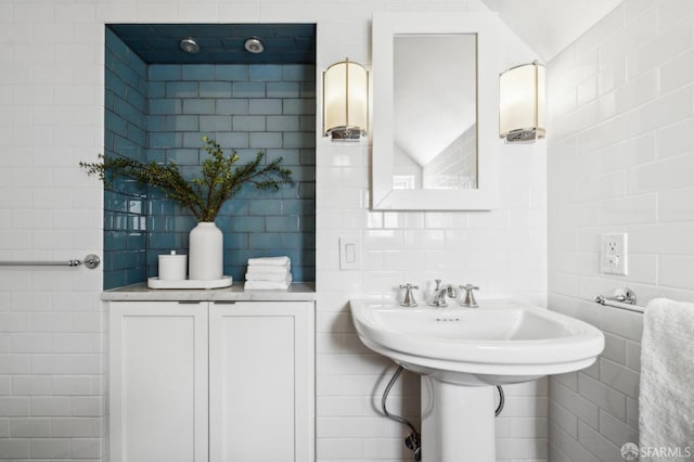 bathroom with tile walls