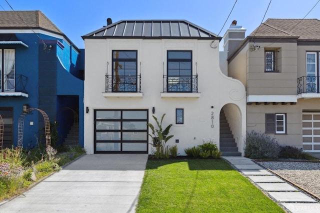 view of front of house featuring a front yard and a garage