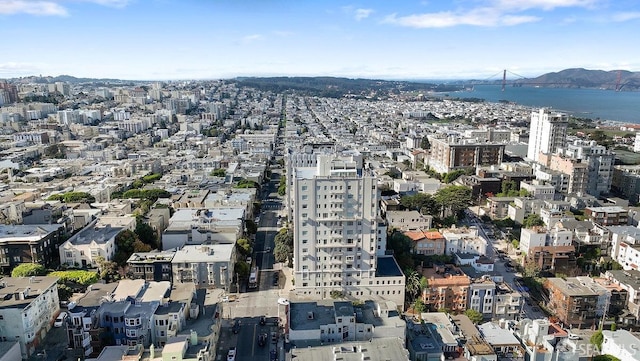 aerial view featuring a water and mountain view